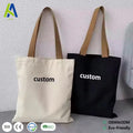 Custom logo canvas tote bag in natural and black
